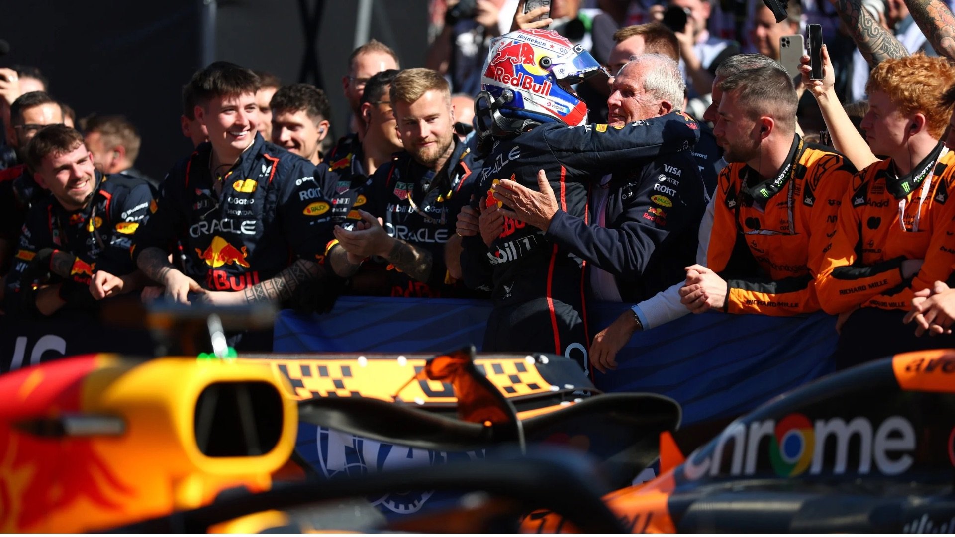 Helmut Marko hugging Max Verstappen after the race